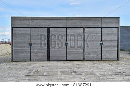 wooden storage and locker rooms near the beach