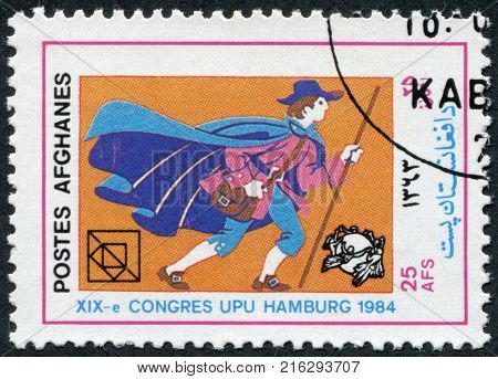 AFGHANISTAN - CIRCA 1984: A stamp printed in the Afghanistan devoted to 19th UPU Congress, Hamburg. Shows a German postman 17th century, circa 1984