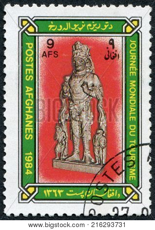 AFGHANISTAN - CIRCA 1984: A stamp printed in the Afghanistan devoted to World Tourism Day. Depicted Standing sculpture of Afghani ruler and attendants, circa 1984