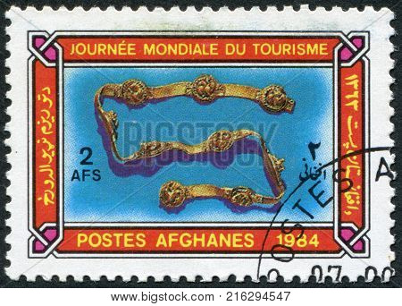 AFGHANISTAN - CIRCA 1984: A stamp printed in the Afghanistan devoted to World Tourism Day. Depicted Ornamental buckled harness, circa 1984