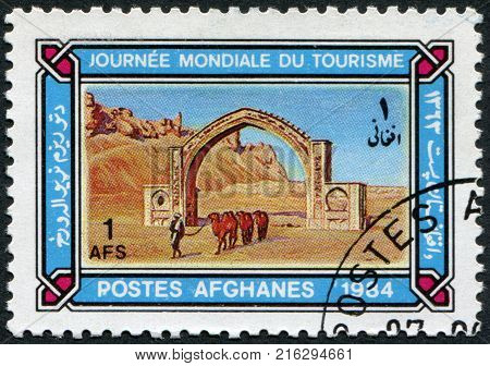 AFGHANISTAN - CIRCA 1984: A stamp printed in the Afghanistan devoted to World Tourism Day. Depicted Qalai Bist Arch, circa 1984
