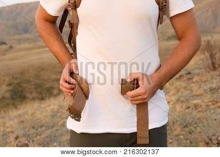 The Young Man Fastens Itself To The Fastex Buckle On The Chest From The Backpack