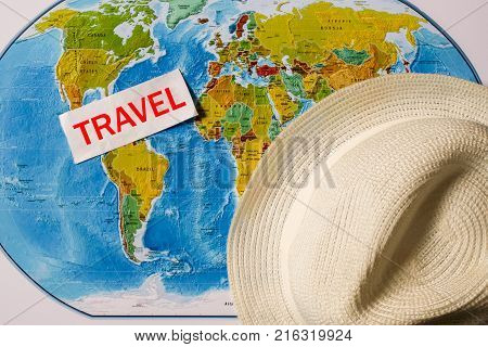 A Photo On Top Of A Journey, A World Map, An Old Camera.