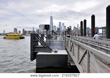 JERSEY CITY USA - AUG. 23 : View of Manhattan from Paulus Hook on August 23 2017 in Jersey City NJ. Manhattan is the most densely populated borough of New York City.