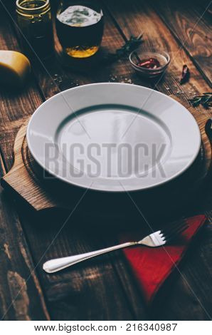 Empty plate on the home wooden rustic table