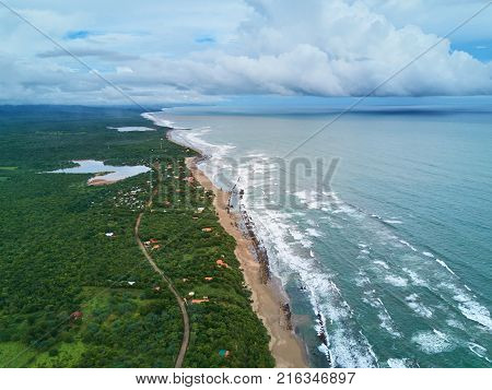 Overcast weather in ocean coastline aerial view. Panorama of pacific coast