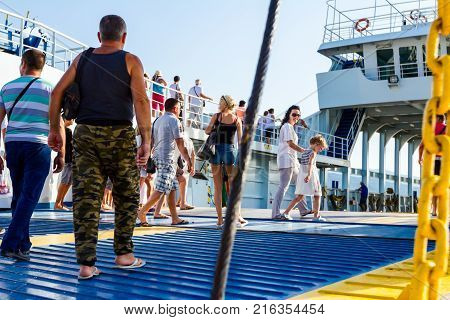 Pefki Island Evia Greece - 11 July 2017: Anchored large ferryboat has opened his front entrance for passengers to enter at the local port.