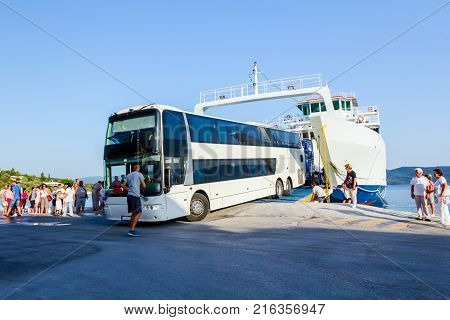 Pefki Island Evia Greece - 11 July 2017: Anchored large ferryboat has opened his front entrance for unloading vehicles at the local harbor