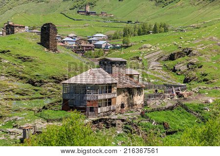View of the Ushguli village at the foot of Mt. Shkhara. Picturesque and gorgeous scene. Rock tower towers and old houses in Ushguli