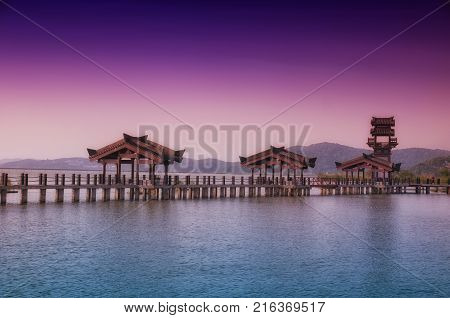 The three kingdoms scenic area walkway and towers in the Wuxi China on Tai lake or taihu in Jiangsu province.