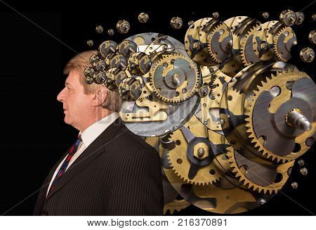 Silhouette of a man with a brain made up of gears or cogs machine parts workings. Concept mental work of the brain