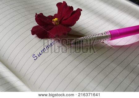 an open page of the notebook with the inscription 