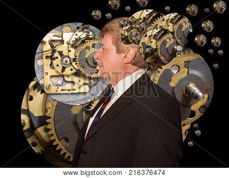 Silhouette of a man with a brain made up of gears or cogs machine parts workings. Concept mental work of the brain