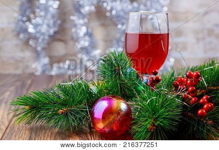 Glasses Of Red Wine In Front Of Christmas Tree For The Holidays