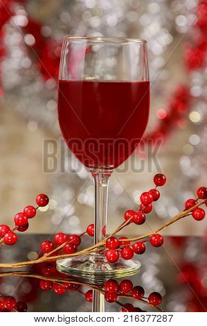 Glasses Of Red Wine In Front Of Christmas Tree For The Holidays