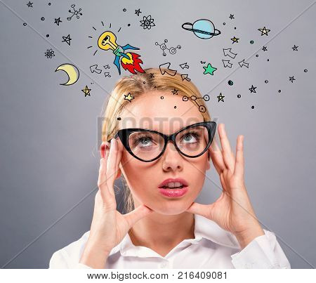 Idear Rocket with business woman on a gray background