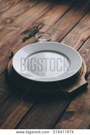 Empty plate on the home wooden rustic table