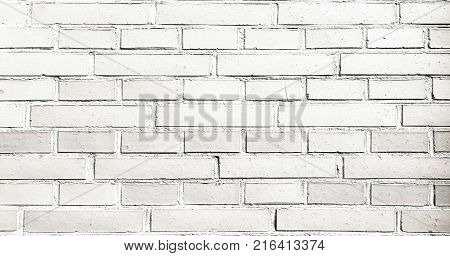 Grungy painted brick wall texture as background. Cracked concrete vintage brick wall background old painted wall. Background brick painting