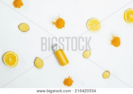 Ginger Shot Healthy Drink With Curd In A Plastic Bottle On White Background. Immunity Boosting Tonic