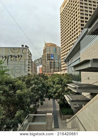 PHOENIX AZ - NOVEMBER 27 2017: Phoenix City Hall and Well Fargo skyscrapers rising above green trees and another buildings.