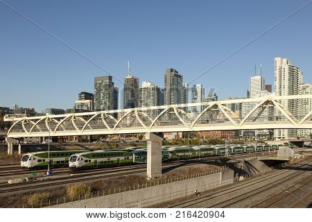 Toronto Canada - Oct 20 2017: Skyline of Toronto downtown. Go doubledecker train in the foreground. City of Toronto Canada