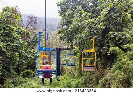 Manizales, Colombia - June 1: Unidentified People Ride The Brightly Painted Ski Lifts Through The Ju