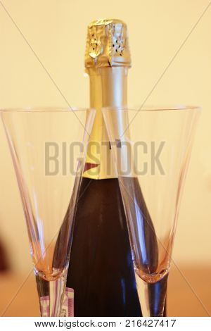 Bottle of shampagne and a pair glasses