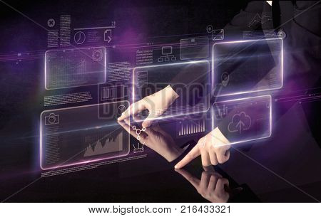 Male hands touching interactive table with purple cloudspace graphic on it 