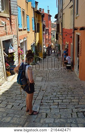 ROVINJ,  ISTRA, CROATIA -  JUNE  20, 2017:  The Steep streets of Rovinj old town with tourists and shops  Croatia.