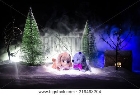 Toy Dog - A Symbol Of The New Year Under The Snow Against The Background Of Fir Branches. Toy's Dog 