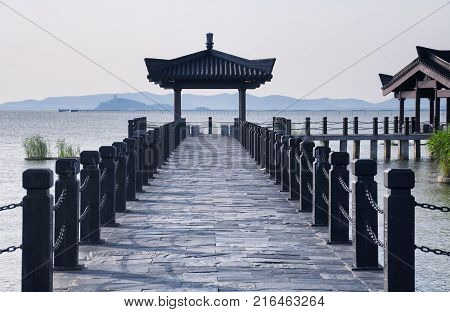 The three kingdoms scenic area walkway and towers in the Wuxi China on Tai lake or taihu in Jiangsu province.