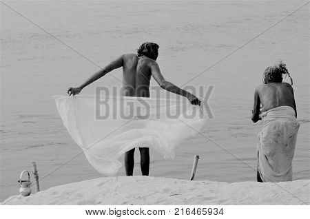 During the kumba mela milions of sadu pilgrims come the holi ganges river the dip and purify by bathung in the water