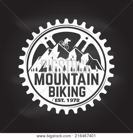 Mountain biking. Vector illustration. Concept for shirt or logo, print, stamp or tee. Vintage typography design with man riding bike and mountain silhouette. Chalk drawing on a blackboard.