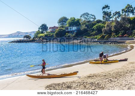 Sandy Bay Hobart Australia - 7 January 2017: sea kayakers about to go for a paddle