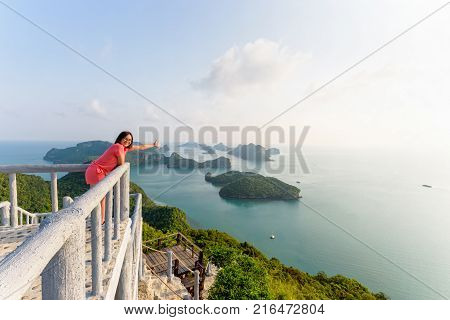 Woman Tourist On Peak Viewpoint Of Island