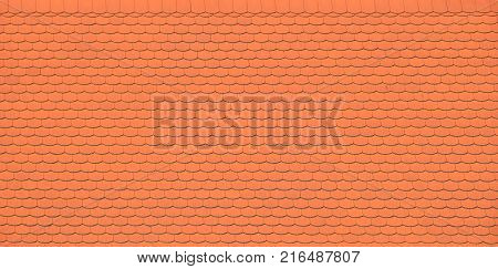 Traditional red brown ceramic roof tiles pattern background, close up, low angle side view