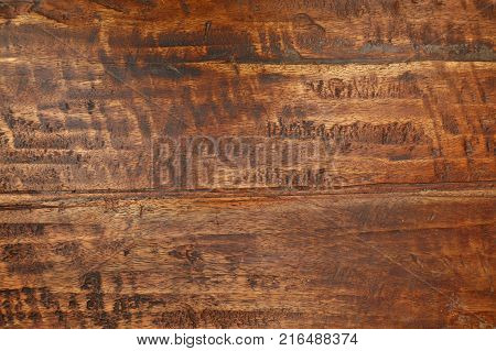 Grunge background texture of brown wood grain with dirty stains, scratches, wholes and cracks