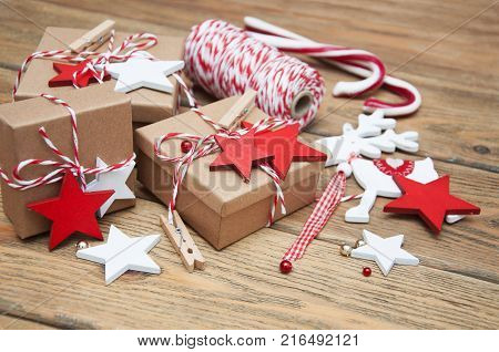 Christmas gift boxes and decorations on wooden background
