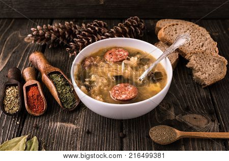Slovak christmas cabbage soup with mushrooms on natural background.