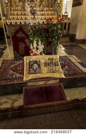 VAGHARSHAPAT ARMENIA - SEPTEMBER 17 2017: Inside one of the oldest Etchmiadzin Cathedrals in the world. It has unique architectural style and design. Altar with chandelier