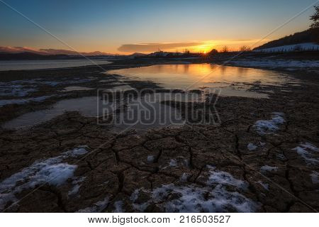 Crevices in the frozen mud in a cold morning