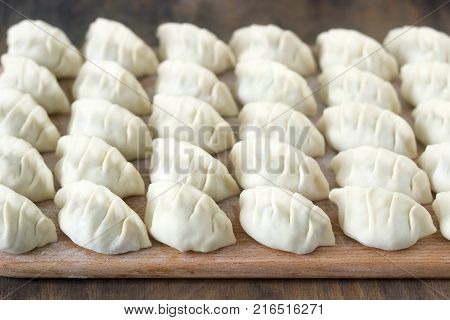 Many Raw Jiaozi Or Gedza Chinese Dumplings, Common In East Asia.
