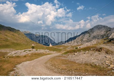 cloudscape on small Church between Moraca Mountain in Montenegro