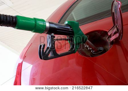 car fill with gasoline at a gas station