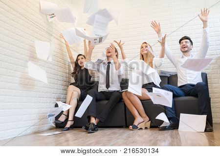 Happy Successful Teamwork Throw Working Year Planng Paper in The Air.Business Corporate People Working Concept.In Selective Focus.
