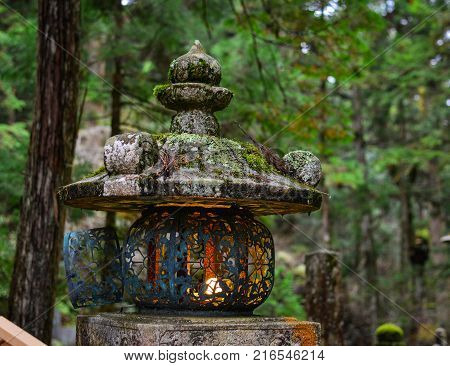 An ancient lantern on Mt. Koya in Wakayama Japan. Mount Koya (Koya-san in Japanese) is one of Japan most sacred mountains.