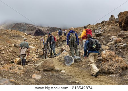 Kamchatka Peninsula, Russia - August 26, 2016: Tourists during the ascent to the active volcano Mutnovsky in Kamchatka.