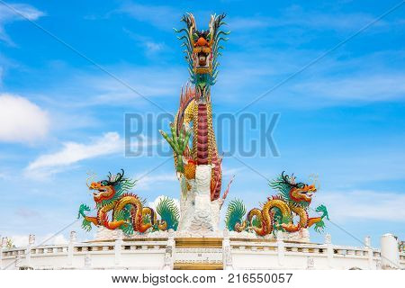 Nakornsawan, Thailand. - October 8, 2017 : Beautiful giant or big colorful dragon statue with blue sky at Nakornsawan Park, Thailand.