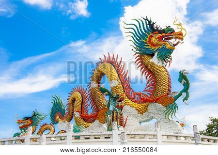 Nakornsawan, Thailand. - October 8, 2017 : Beautiful giant or big colorful dragon statue with blue sky at Nakornsawan Park, Thailand.