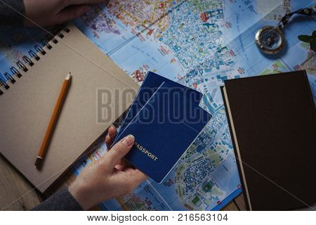 Travel Concept. Female Hand Marks The Spot On The Map. Top View